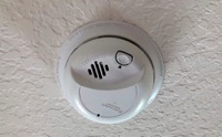 What is the HUD-code minimumum requirement for smoke alarms in a manufacture/mobile home?