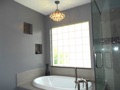 Why can't I put a chandelier over the spa tub in my master bath? It would look wonderful!