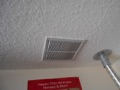 Can a grille covering a hole in the drywall ceiling be used for the required make up (combustion supply) air for a gas water heater or furnace in a garage?