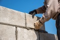 What is the average life expectancy of a concrete block wall (CMU - Concrete Masonry Unit)?