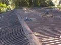 What is the average life expectancy of a corrugated asphalt panel roof?