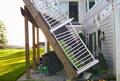 What is the most common cause of a wood deck collapse?