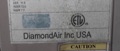 How do I determine the age of a DiamondAir heat pump or air conditioner?