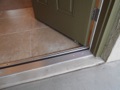 What is code for the step-down at the landing for an exterior door?