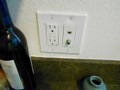 When were GFCI receptacle outlets first required in the kitchen?