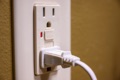 Is it legal to install a three-prong outlet without a ground?