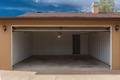 Do I need a permit enclose a carport into a garage?