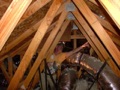 Should roofing nails be visible sticking into the attic?