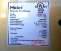 How do I find the age of a Haier heat pump or air conditioner from the serial number?