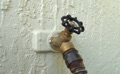 How many hose bibbs (outdoor faucets) are required by code for a house?