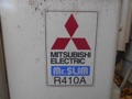 What size in tons is a Mitsubishi air conditioner or heat pump from model number?