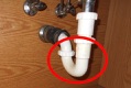 What is the minimum trap seal depth under a sink drain?