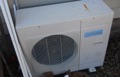 How can I tell the age of a Panasonic heat pump or air conditioner from the serial number?