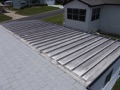 What is the average life expectancy of a patio cover roof (insulated and non-insulated)?