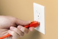 What is the lowest acceptable voltage for a wall receptacle outlet?