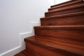 What is the minimum step depth (tread) allowed on a stair?