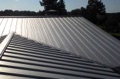 What are the pros and cons of a standing seam metal roof?