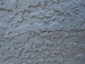What are the signs of stucco wall leaks?
