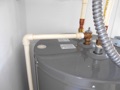 Does a home inspector test the temperature/pressure relief valve at the water heater?