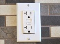 Does a home inspector remove receptacle outlet cover plates?