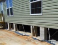 Can a mobile home permanent foundation be concrete blocks on pads and screw-in anchors?