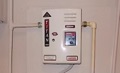How do I determine the age of a Titan tankless water heater?
