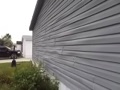What causes warped, buckled vinyl siding?