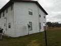 Should I be suspicious of an old wood frame house covered with vinyl siding?